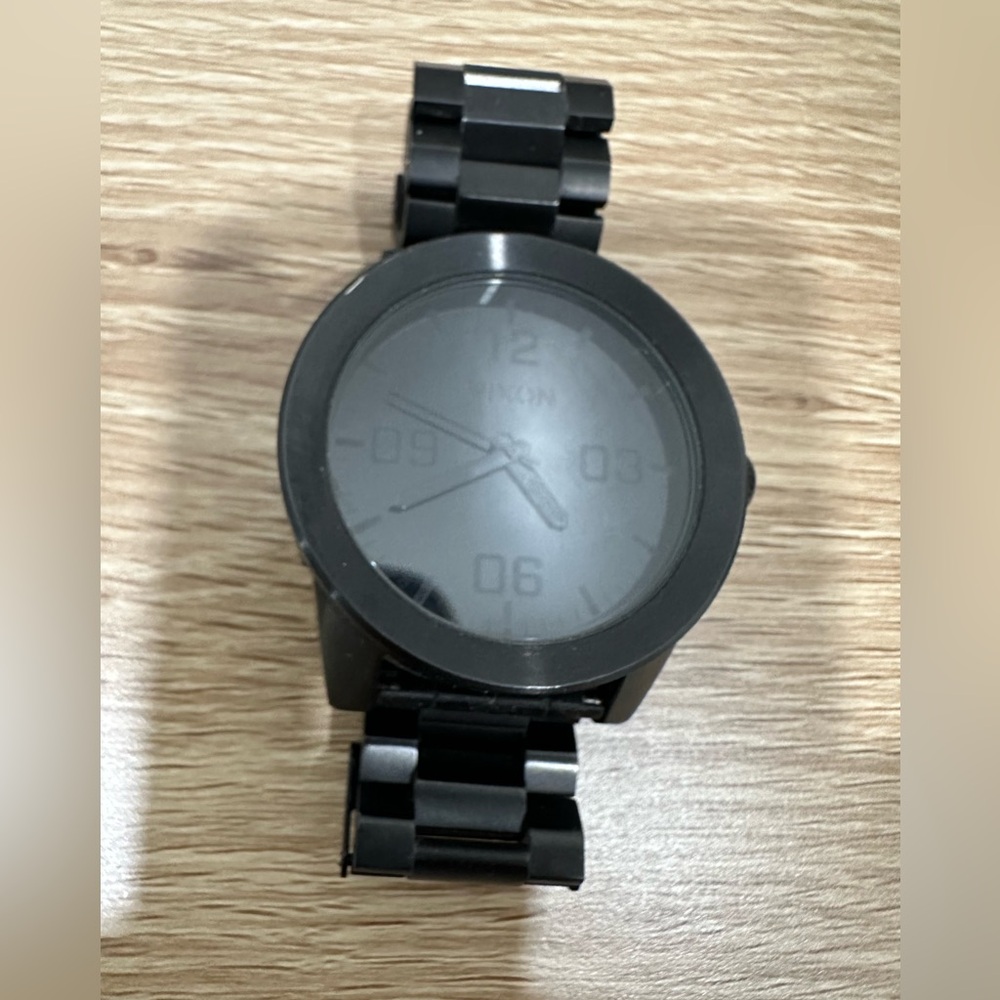 Black on black Nixon watch